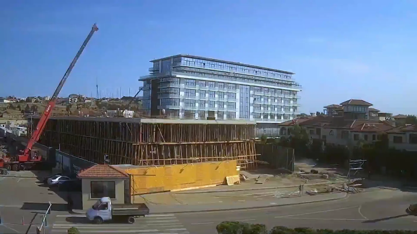 2022: next to a finished Lighthouse building, work begins on the next one, and a crane is at work