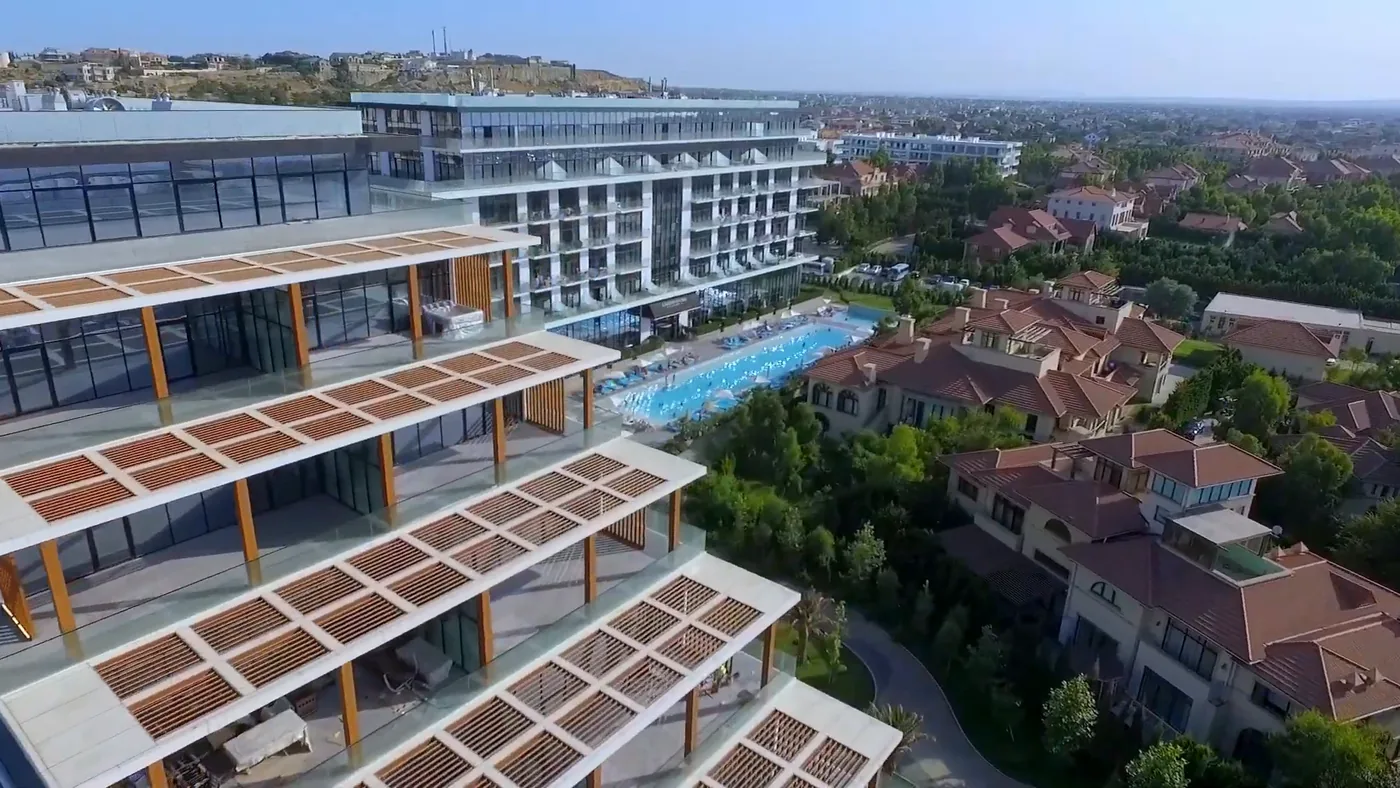 The upper-floor terraces of Lighthouse look out over the courtyard with the pool and the villas