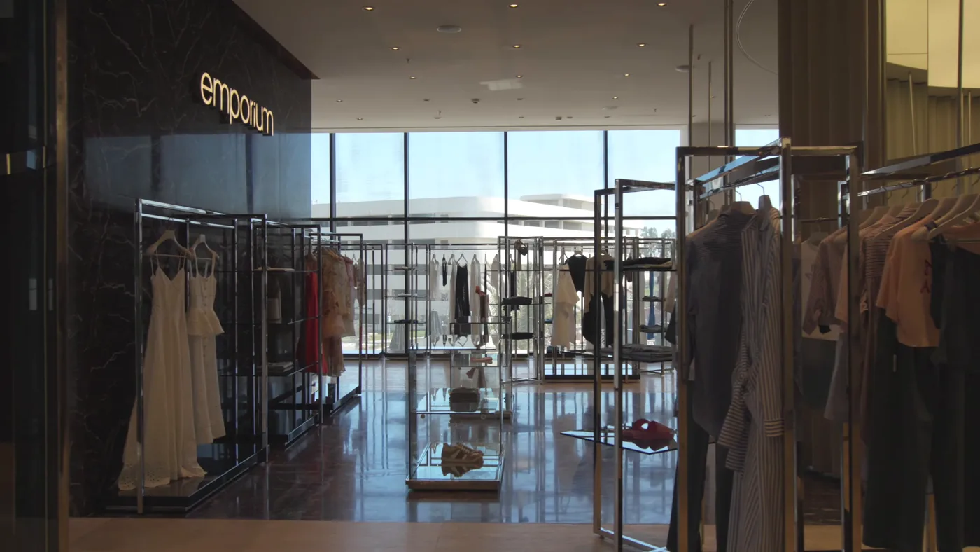 Inside Lighthouse Mall: the hall of the Emporium department store, with the street behind the glass