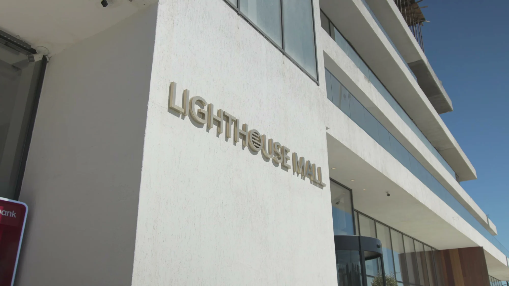 The Lighthouse Mall sign on the facade of the shopping center